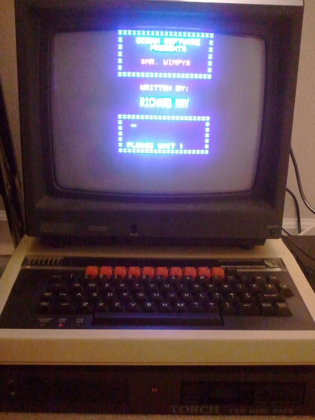 BBC Micro attached to Amstrad CPC monitor and twin floppy drives